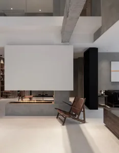 Modern lounge area with concrete elements and a minimalist design.