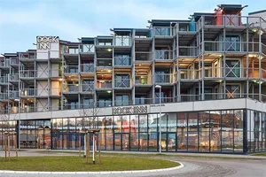 Modern hotel building with metal and glass structure.