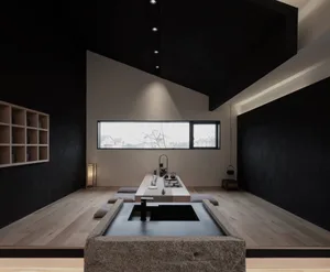 A minimalist tea room featuring teak furniture and a stone water basin.