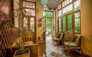 Modern, luxurious lobby featuring wood flooring and elegant seating.