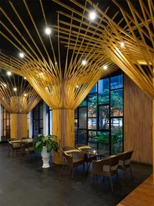 A modern cafe interior with a wooden ceiling and floor, featuring comfortable seating and large windows.