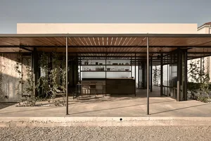 A modern residential space featuring a concrete floor and minimalist design.