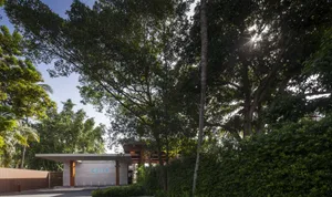 A modern building with concrete and glass exterior materials.