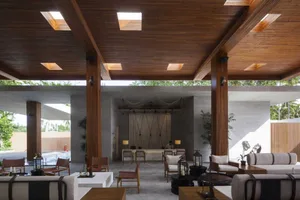 Modern interior design featuring a lobby with a reclaimed wood ceiling and flooring.