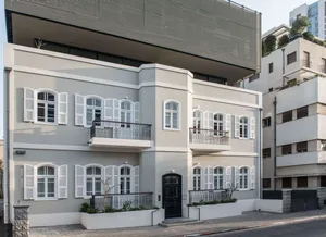 A modern residential building with a concrete exterior.