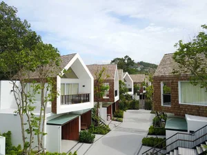 Modern residential homes featuring wooden shingle exteriors.