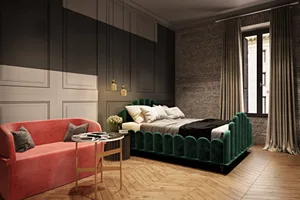 A luxury bathroom with a green velvet bed, brick walls, and wooden floors.