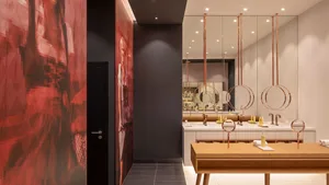 Modern minimalist spa retreat room with sleek copper lighting and metallic finishes.