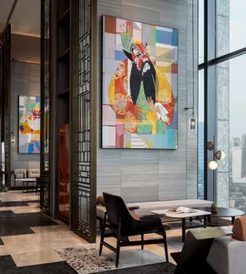 A modern lobby features a combination of concrete, glass, and metal materials.