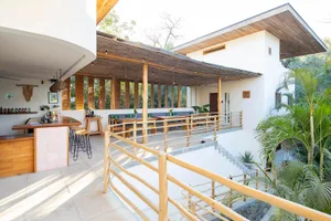 An outdoor restaurant patio featuring timber and concrete elements.