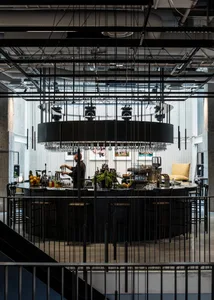An industrial-style coffee bar featuring concrete materials and a minimalist design.