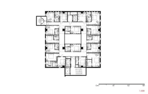 Floor plan drawing of a residential building with multiple rooms and balconies.