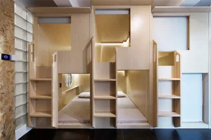 Modern interior design featuring wooden shelves and minimalist furniture.