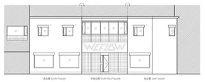 Modern retail storefront with large glass windows and concrete facade