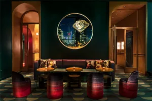 Industrial-style restaurant bar featuring metal, glass, and fabric elements.