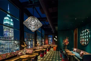 Modern rooftop bar featuring cityscape views.