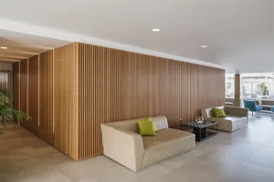 Modern commercial interior featuring minimalist design, wood-paneled walls, and contemporary furniture.