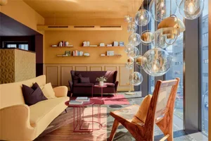 Modern living room featuring a combination of materials such as wood, glass, and metallic elements.