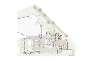 Floor plan of a modern office space with various rooms and seating arrangements.