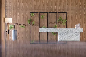 A minimalist reception desk made of marble with a modern design.