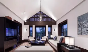 Modern living room with white furniture, wooden accents, and large windows.
