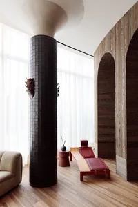 A modern spa interior featuring wooden flooring and minimalist design elements.