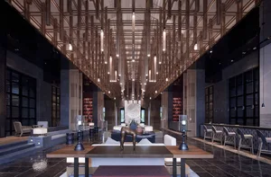 Modern hotel reception lobby featuring metallic lighting and concrete architecture