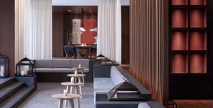 Modern lounge area with concrete seating and metal accents