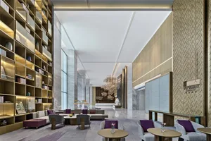 Modern lobby interior design featuring marble, concrete, and glass materials.