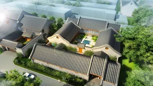 A traditional courtyard residence featuring brick walls and a tiled roof.