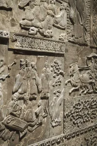 Ancient stone relief carving depicting historical events