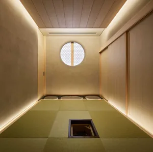 Modern living room with tatami mats and a round window
