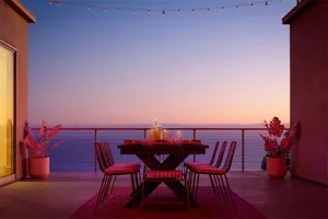 Metal chairs and wooden accents on a minimalist residential deck.