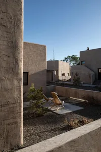 A residential space featuring contemporary concrete architecture and minimalist design.