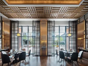 A modern restaurant interior featuring wood and glass materials.