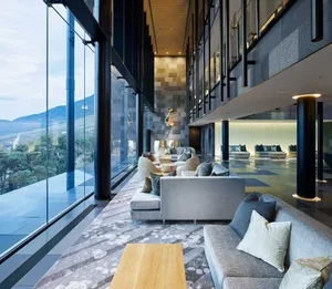 Modern hotel lobby featuring concrete and glass materials