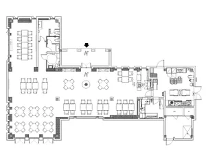 Floor plan of a modern cafeteria with contemporary furniture and seating arrangements.