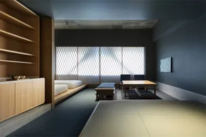 A minimalist interior design featuring concrete and textured materials.