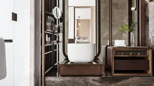 Modern, minimalist bathroom featuring a white freestanding bathtub on a dark marble countertop with a sink, mirror, and illum