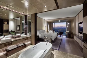 Modern, luxurious hotel suite with a stylish and contemporary design, featuring high-quality materials and a comfortable atmo