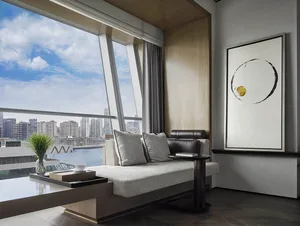 Contemporary living room with tiled concrete floor, modern furniture, and cityscape view.