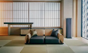 A modern living room featuring timber furniture, including a sofa with cushions and a wooden cabinet.