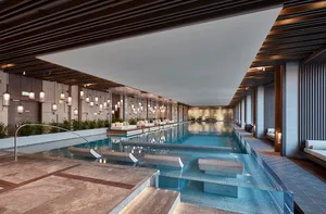 A luxurious indoor swimming pool with modern design features.
