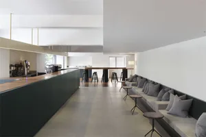 A modern cafe bar and restaurant with mixed-materials and sleek design.