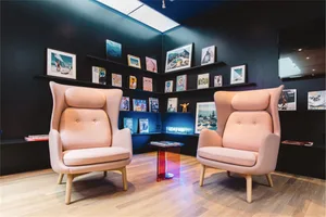 A living room featuring two modern fabric armchairs