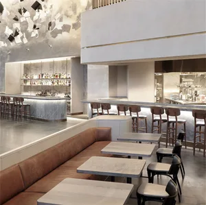 A modern restaurant bar with concrete, marble, wooden, and leather elements.