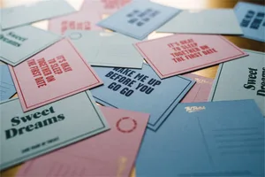 Various pieces of paper with motivational quotes and messages printed on them