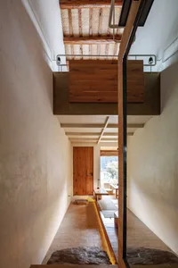 Minimalist corridor interior with wooden and concrete elements