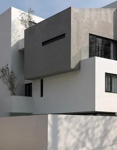Modern building with concrete exterior and minimalist design.