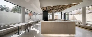 Modern cafe bar interior with concrete, marble, and wooden finishes